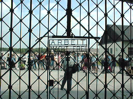 photo of tourist group seen through Dachau gate, July 1997