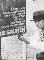 Josef Beuys with a poster for the Green party, 1980